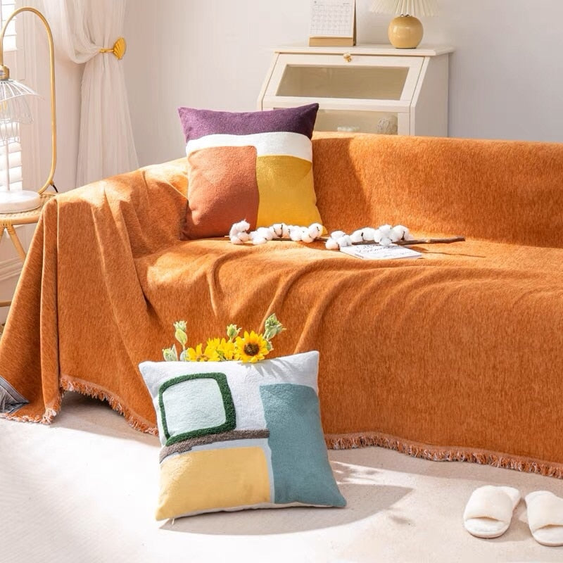 Thick chenille sofa throw with tassels, offering spill and stain protection